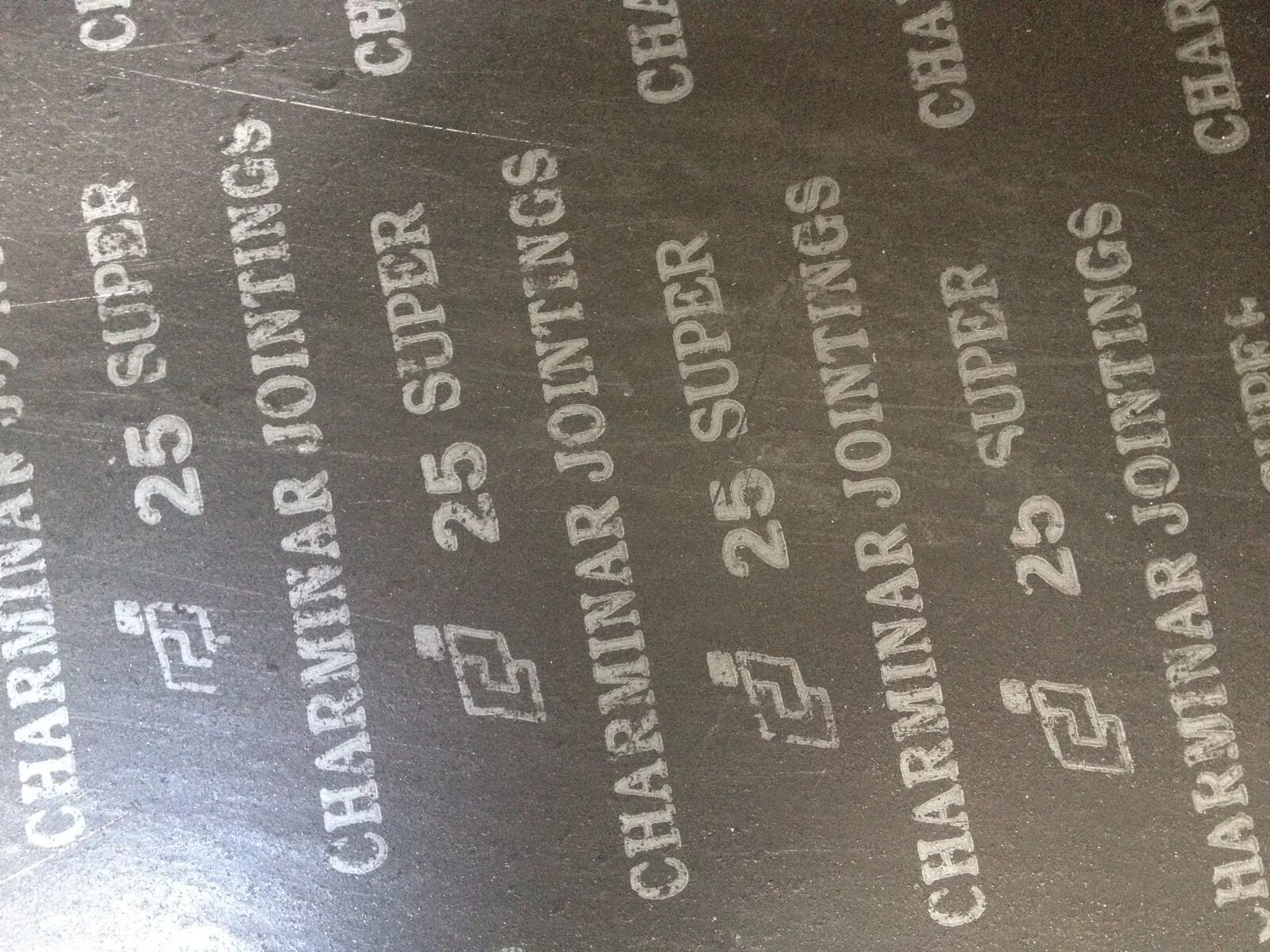 Bề mặt tấm bìa amiang CJ-25 SUPER in chữ 25 SUPER Charminar Jointings